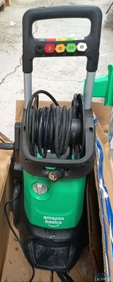 a green and black power washer sitting in a box