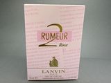 an image of a box of perfume sitting on top of a table