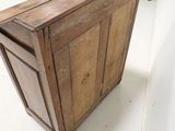 an old wooden cabinet in the middle of a room