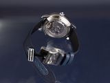 a close up of a wrist watch on a table