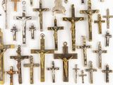 many different types of crucifs displayed on the wall