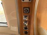 a view of the inside of a motorhome from the driver ' s seat