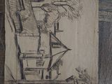 a drawing of a house on a piece of paper on the floor
