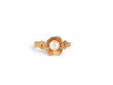 an image of a gold ring with a pearl in the center