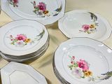a lot of plates that are sitting on a table