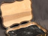 a small wooden box with a mirror inside of it