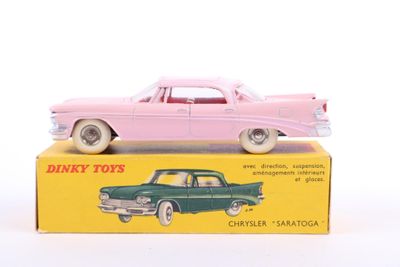 pink and green toy cars sitting on top of a yellow box