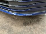 a close up of a blue car that has been painted