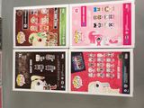 four posters on the wall of a store