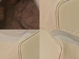 the back of a pair of beige shoes with white soles