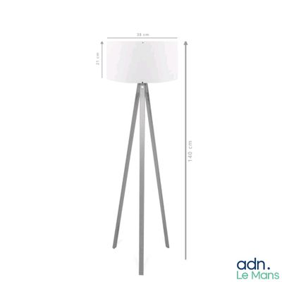 the floor lamp has a white shade on it and a wooden tripod base