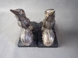 two birds that are sitting on top of each other