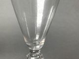 a wine glass that is sitting on a table