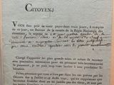 an old document with writing on it sitting on top of a table