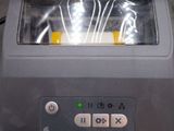 a machine that is sitting on the floor with a lot of wires