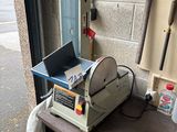 a machine that is sitting on a shelf in a garage