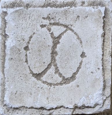 a stone with a peace sign drawn on it