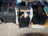a pile of luggage sitting on the floor next to a pile of suitcases