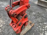 a red machine that is sitting on the ground