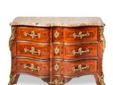 an antique chest of drawers with marble top