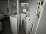 an image of a bathroom with a washer and dryer in it