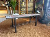 a table that is sitting on a rug in a room
