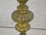 a gold colored lamp that is sitting on a table