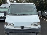 a white van that is parked in a parking lot