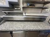 a kitchen counter with a sink and a dishwasher in it