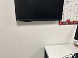 a desk with a computer and a monitor on it