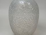 a glass vase that is sitting on a table