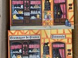 two books in a cardboard box with a picture of a store front
