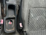a picture of the inside of a vehicle with the seat up