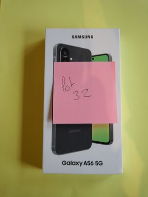 packaging of a phone with a sticky note attached to the back of it