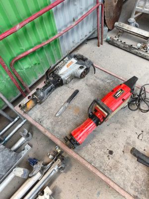 a picture of a pair of electric tools sitting on the floor