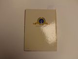 a white toilet with a blue and yellow emblem on it