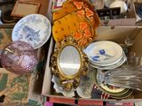 a box full of assorted dishes and plates