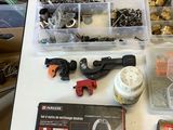 a table with a bunch of tools and a box of screws