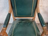 leather upholstered chair with wood frame and green upholstered seat