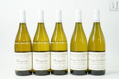 six bottles of wine are lined up in a row on a white surface
