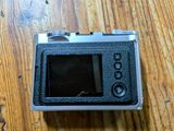 a camera that is sitting on a wooden table