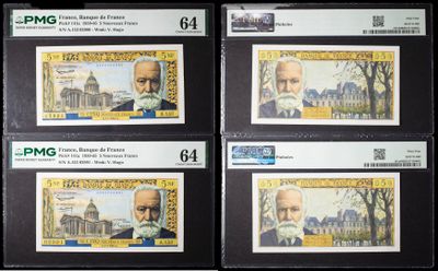 four different types of paper money are on display in a store