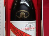 a bottle of champagne in a box on a table