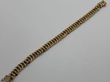a gold chain bracelet with a clasp on a white background