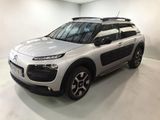 a white citrole is parked in a white room
