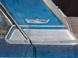 a close up of a blue car with the door open