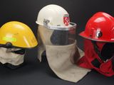 three different types of hard hats are lined up against a black background
