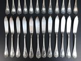 a lot of forks and spoons that are on a table