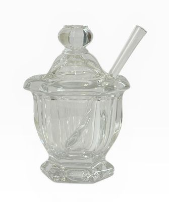sucrier en verre transparent avec une cuillère à l'intérieur
