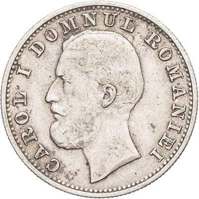 a close up of a coin with a man ' s face on it